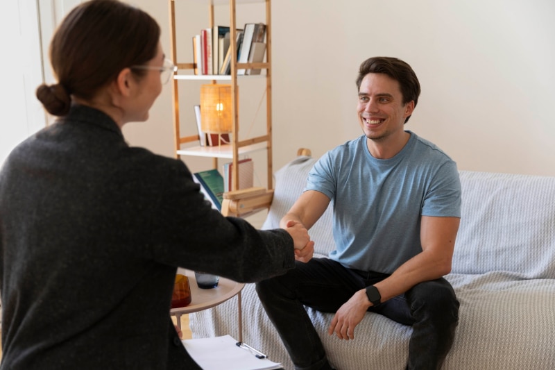 An example of person Centered therapy in Colorado Springs. Here the client is greeted, sitting, by a counselor at the beginning of the session.